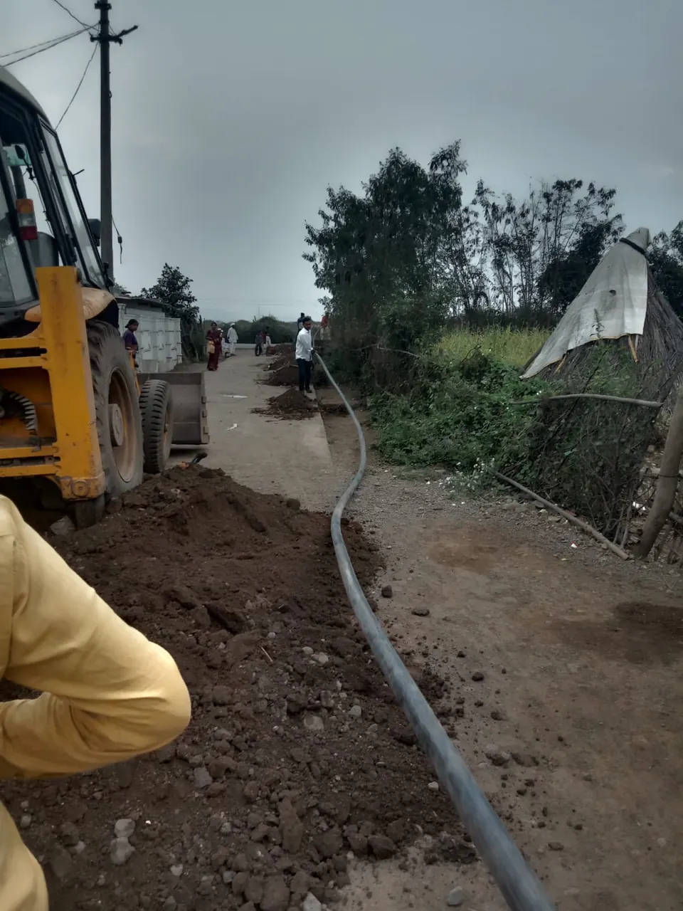 HDPE water line laid along a village road