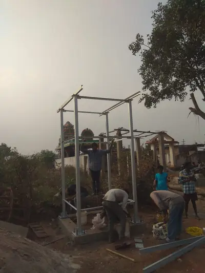 Team working on a steel tank stand frame